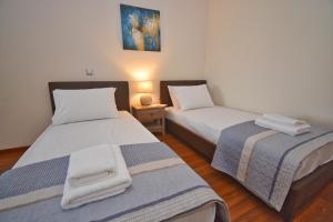 Postel nebo postele na pokoji v ubytování Casa D' Oro Corfu