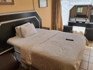 Katil atau katil-katil dalam bilik di Miami guest house