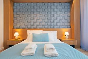 Łóżko lub łóżka w pokoju w obiekcie Apartamenty Prestige Browar Lubicz Stare Miasto
