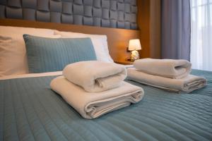 Łóżko lub łóżka w pokoju w obiekcie Apartamenty Prestige Browar Lubicz Stare Miasto