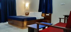 Hotel Agni 객실 침대