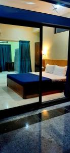 Hotel Agni 객실 침대