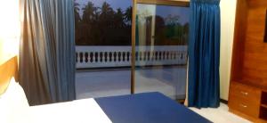 Hotel Agni 객실 침대