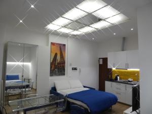 a hospital room with a bed and a mirror at Giudei House Loft 2 in Bologna +14 photos
