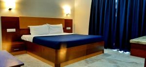Hotel Agni 객실 침대