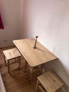 a wooden table with a tool on top of it at Pension S láskou Karel Bezděz in Schloss Bösig