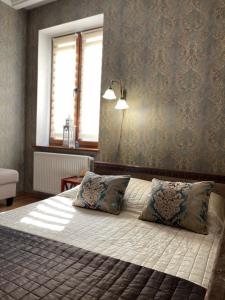 Ένα ή περισσότερα κρεβάτια σε δωμάτιο στο Apartment on Franka +20 φωτογραφίες