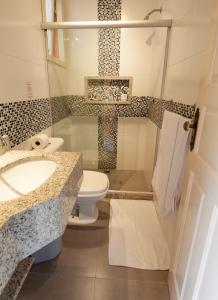 Um banheiro em Pousada Casablanca