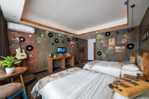 Krevet ili kreveti u jedinici u okviru objekta Zhangjiajie Highlights Guesthouse