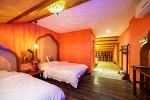 Krevet ili kreveti u jedinici u okviru objekta Zhangjiajie Highlights Guesthouse