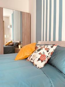 a bed with two pillows on top of it at Casa Antonietta in San Paolo Bel Sito