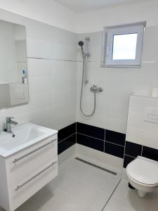 Kúpeľňa v ubytovaní Vár-Lak Apartman