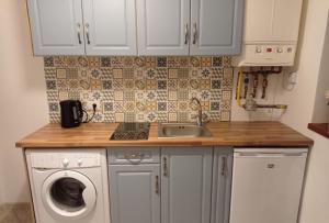 Η κουζίνα ή μικρή κουζίνα στο Sunrise Castelului Brasov ( Old Center) +31 φωτογραφίες