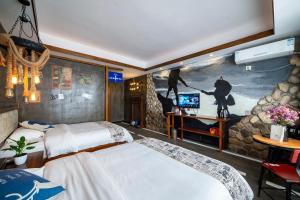 Krevet ili kreveti u jedinici u okviru objekta Zhangjiajie Highlights Guesthouse
