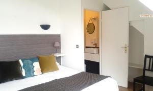 Cama ou camas em um quarto em Hotel De L'Europe