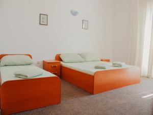 Postel nebo postele na pokoji v ubytování Apartments and Rooms Mato