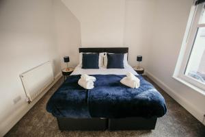 Postel nebo postele na pokoji v ubytování PARKER St by Prestige Properties SA