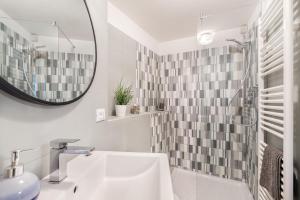 a bathroom with a sink and a mirror at il Mare di Ada:seaside apartament in Riomaggiore in Riomaggiore