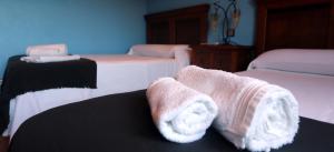 A bed or beds in a room at Casal Pedrajás