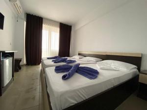 Postel nebo postele na pokoji v ubytování Tiberius Residence