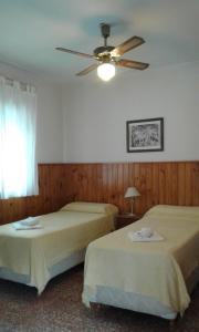 Ένα ή περισσότερα κρεβάτια σε δωμάτιο στο Amanitas Posada +9 φωτογραφίες