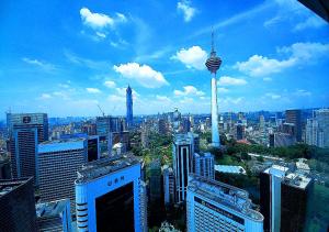 a view of a city with a view of the space needle at Vortex Suites at KLCC Area in Kuala Lumpur