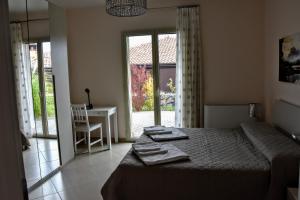 Posteľ alebo postele v izbe v ubytovaní L'elicriso B&B