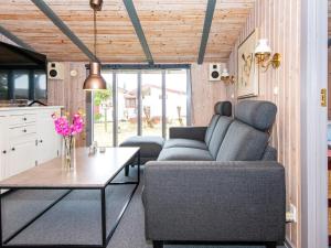 a living room with a couch and a table at 6 person holiday home in Fan in Fanø