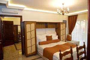 Giường trong phòng chung tại Gránit Villa