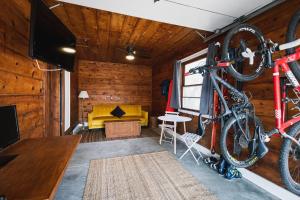 a room with a bike hanging on the wall at Left Coast Lodge - Pet Friendly in Sisters