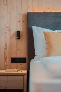 Posteľ alebo postele v izbe v ubytovaní Kierhof Chalets
