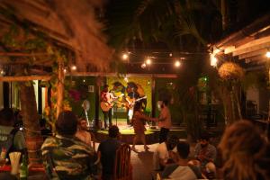 a group of people watching a band playing on a stage at Jungle by sturmfrei Vagator in Vagator