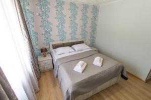 Postel nebo postele na pokoji v ubytování Katos Guesthouse Mestia