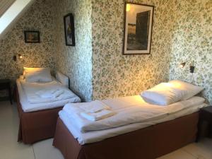 A bed or beds in a room at Lunkaberg Bed & Breakfast