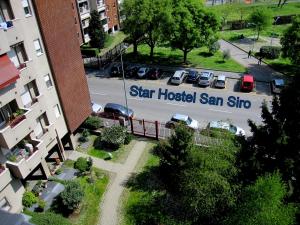 a sign that reads star hospital san shmo in a parking lot at Star Hostel San Siro Fiera in Milan
