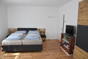 En eller flere senger på et rom på Appartement Wagner