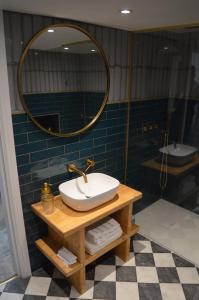 a bathroom with a sink and a mirror at Grooms House in Hebden Bridge