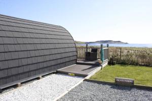 a black building with a view of the ocean at Ose Pod, an ever changing view to the sea in Ose