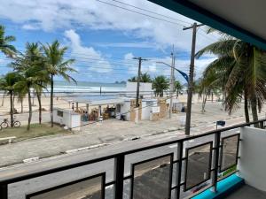 a view of the beach from a bus at Santa Helena Pousada in Guarujá +27 photos