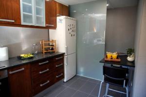 Kuchyň nebo kuchyňský kout v ubytování BlancoHouse. fozdodouro + 7 fotografií