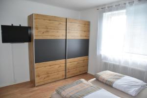 En eller flere senger på et rom på Appartement Wagner