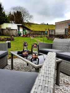 a patio with a table with two candles on it at Cranmore House - a walkers' and cyclists' dream in Nenthead