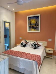 Cama ou camas em um quarto em Pousada Casablanca