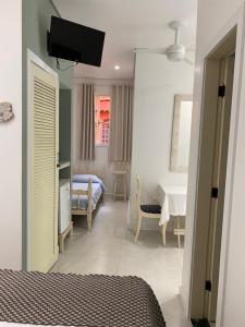 Cama ou camas em um quarto em Pousada Casablanca