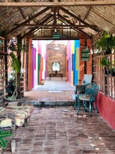 an empty hallway with colorful walls and chairs in a building at Villa da Serra Pousada in Piumhi +36 photos