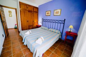 Ein Bett oder Betten in einem Zimmer der Unterkunft Casa Rural San Antonio