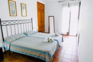 Ein Bett oder Betten in einem Zimmer der Unterkunft Casa Rural San Antonio