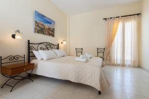 Postel nebo postele na pokoji v ubytování Sardis Rooms