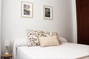 Posteľ alebo postele v izbe v ubytovaní Apartamento centro paseo maritimo