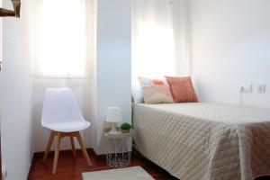 Posteľ alebo postele v izbe v ubytovaní Apartamento centro paseo maritimo